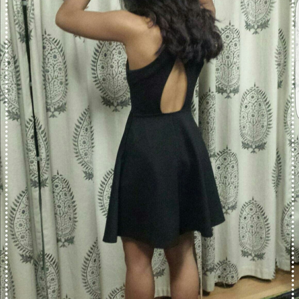 Black skater style with open back. Size small